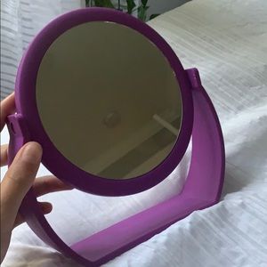 a small purple mirror